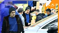 Protejat doar de o căciulă cu Îngeri, Gigi Becali a făcut pe Moș Crăciun într-o parcare plină de colindători