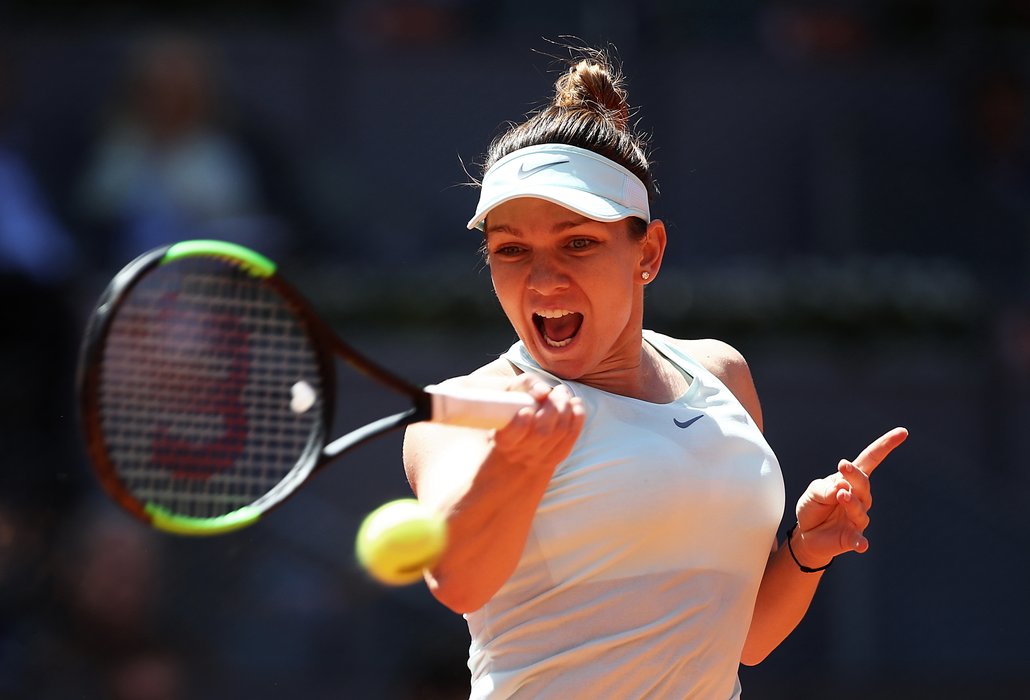 MADRID, SPAIN - MAY 09:  Simona Halep of Romania in action against Ashleigh Barty of Australia in the quarter finals during day six of the Mutua Madrid Open at La Caja Magica on May 09, 2019 in Madrid, Spain. (Photo by Julian Finney/Getty Images)