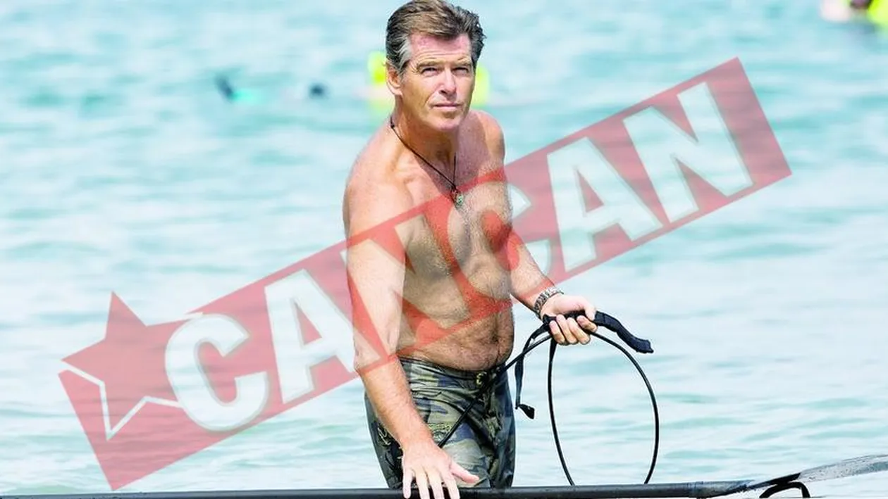Brosnan, in bustul gol la surfing