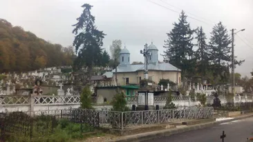 Scandal cu focuri de armă în cimitirul din Moreni. Preotul s-a certat cu doi enoriași