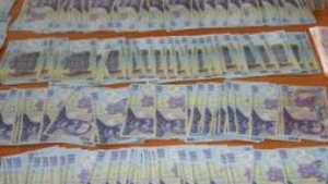 Domiciliul politistului din Slatina care falsifica bani este perchezitionat de catre anchetatori!