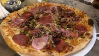 Nu este o eroare! Câți bani a plătit un turist român pentru o pizza, într-un restaurant din Bulgaria