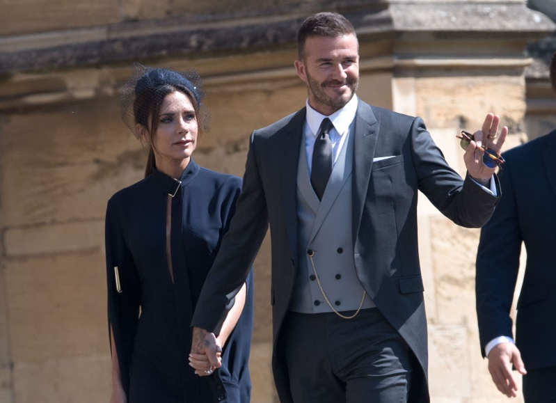David și Victoria Beckham la nunta regală, dintre Prințul Harry și Meghan Markle. David Beckham a mestescat gumă la nuntă