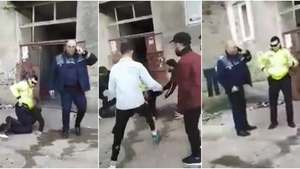 Imagini incredibile în Bacău! Mai mulți tineri iau la bătaie un polițist, în timp ce colegul agentului vorbește la telefon