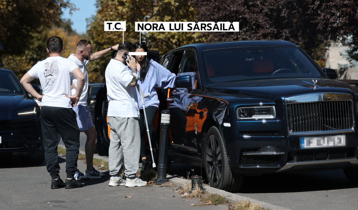 T.C. vorbește la telefon, în timp ce bruneta iese din Rolls (Foto: CANCAN.RO)