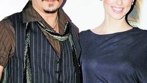 Amber Heard a primit binecuvantarea sa fie cu Johnny Depp... de la fosta ei iubita!