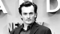 Comunicat: Rupert Friend se alătură lui John Malkovich în distribuția filmului Cravata Galbenă