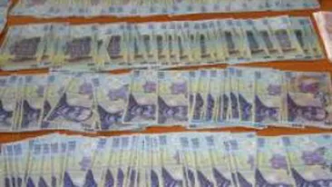 Domiciliul politistului din Slatina care falsifica bani este perchezitionat de catre anchetatori!