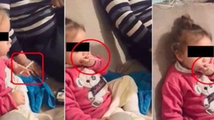 Caz şocant în Tulcea! Fetiţă de 3 ani pusă de familie să fumeze şi să bea: „Aşa, stai ca barosanii!” Întreaga scenă a fost filmată

