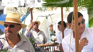 Cristi Borcea și “Tăticul McDonald’s”, șpriț rece și trabuc pe plaja milionarilor. Cum s-au protejat înainte de “tratament”