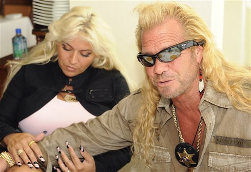 ** FILE ** In this May 14, 2008 file photo, Duane "Dog" Chapman, right, is joined by his wife Beth Chapman at a news conference in Honolulu, Hawaii announcing the return of their reality television series "Dog The Bounty Hunter." An actor who says he created the "Dog the Bounty Hunter" reality series, complains in court papers that he was the target of "abusive, violent and outrageous conduct" and "episodes of psychotic behavior by" the Chapmans, in a lawsuit against the show's producers for missing royalties, salary and other compensation. (AP  photo/Ronen Zilberman, File)