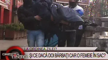 VIDEO E jale pe strazile din Bucuresti! Doi barbati calca in picioare o femeie si o baga intr-un sac - Vezi cum a reactionat lumea!