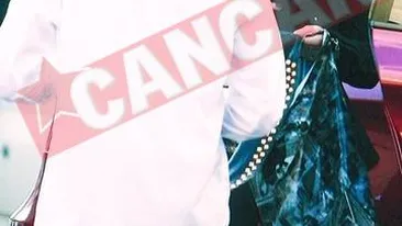 Prodanca probeaza haine pe strada