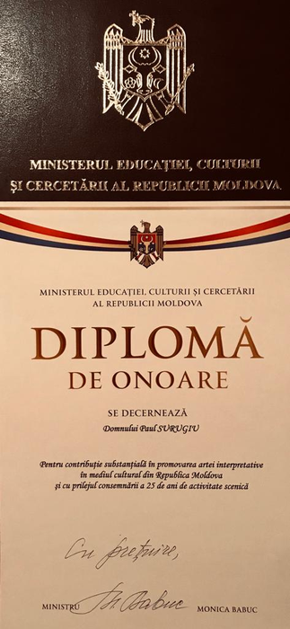 Ministerul Culturii Republicii Moldova i-a decernat lui Paul Surugiu o distincție de onoare pentru contribuția deosebită adusă muzicii și pentru cei 25 de ani carieră