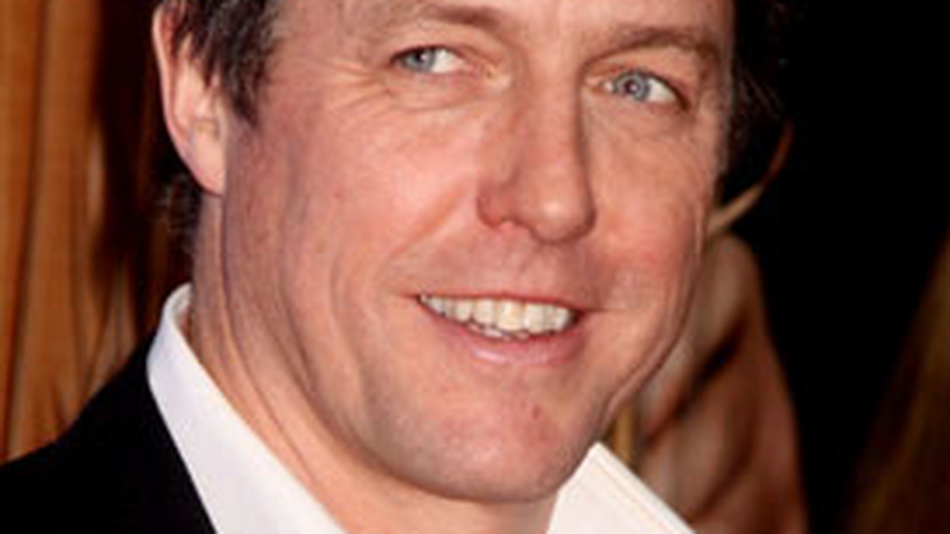 Hugh Grant vrea sa scrie o carte