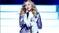 Madonna iese la plimbare, deghizată din cap până-n picioare