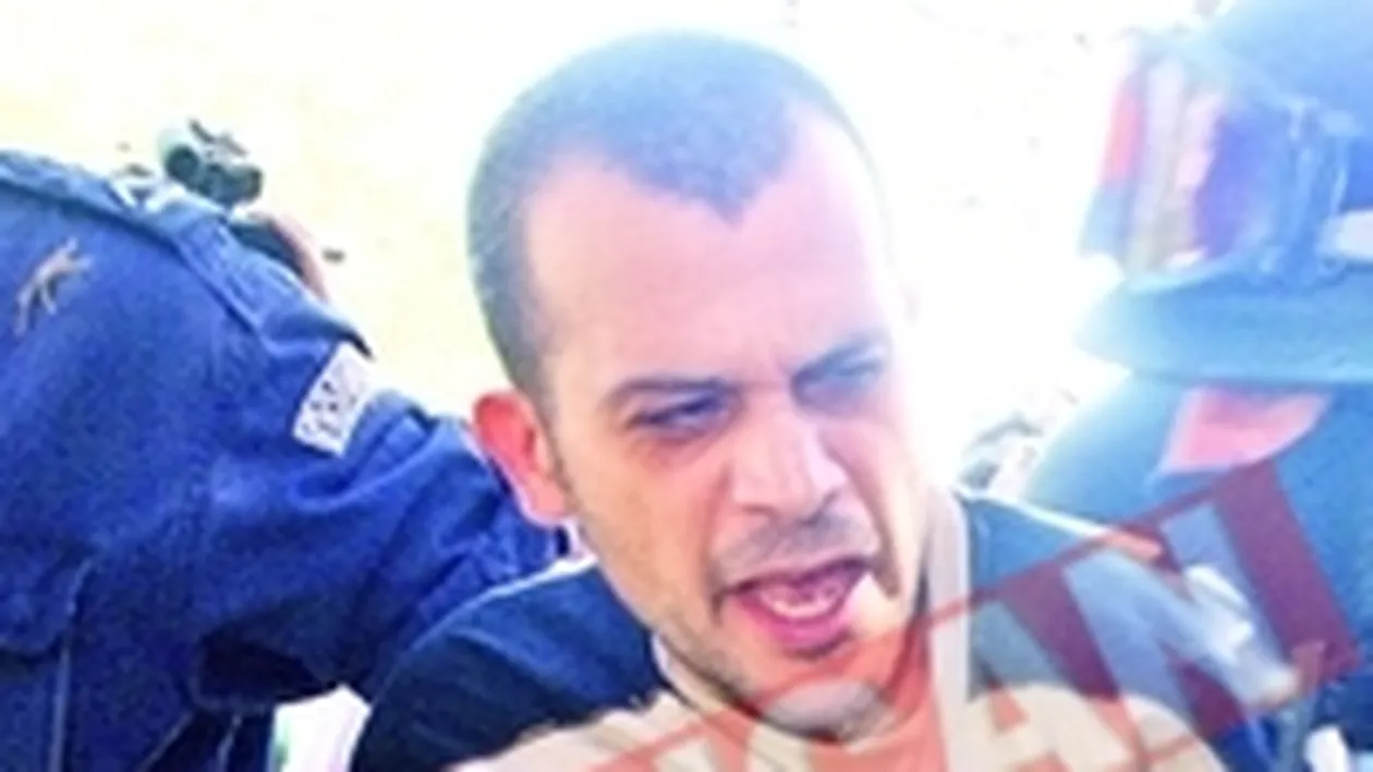 Ucigasul din Giulesti, prins cu telefon in celula