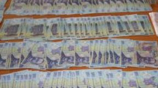 Domiciliul politistului din Slatina care falsifica bani este perchezitionat de catre anchetatori!