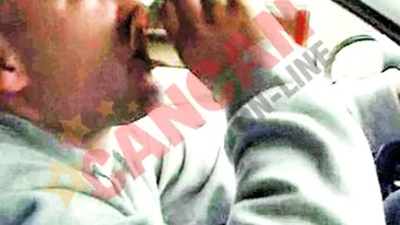 Filmat in timp ce bea la volan