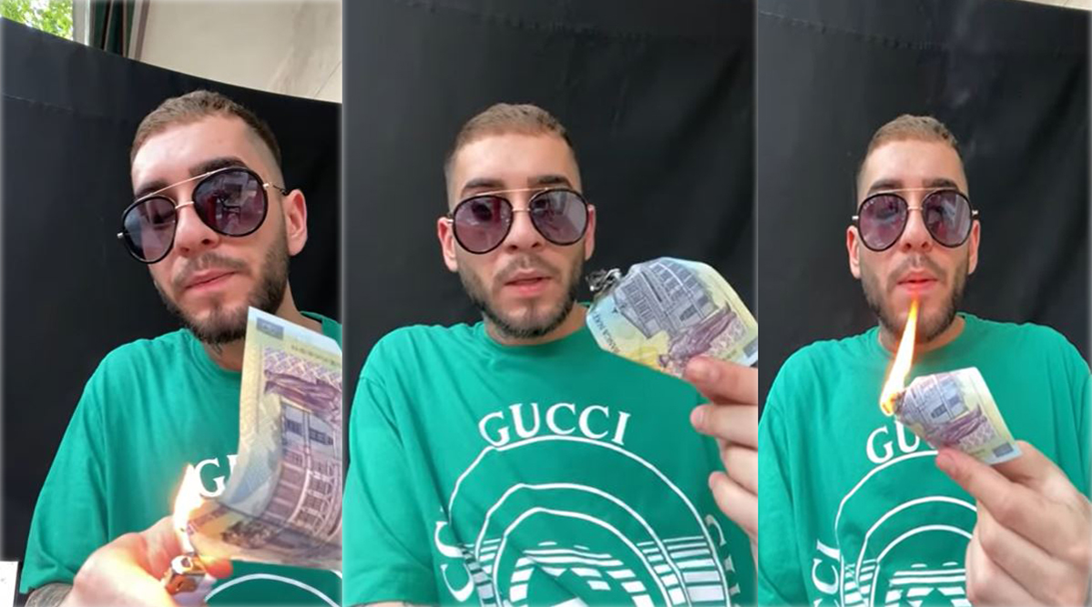 Fulgy, dând foc unei bancnote de 100 de lei