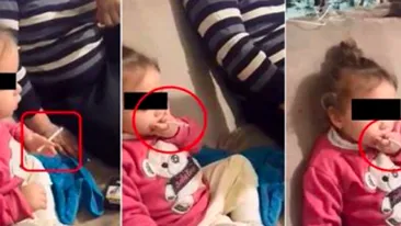 Caz şocant în Tulcea! Fetiţă de 3 ani pusă de familie să fumeze şi să bea: „Aşa, stai ca barosanii!” Întreaga scenă a fost filmată

