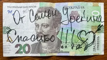 Mesajul incredibil lăsat de o familie de 12 ucraineni pe o bancnotă, după ce au fost găzduiţi de un român: Vă rog, cine poate traduce