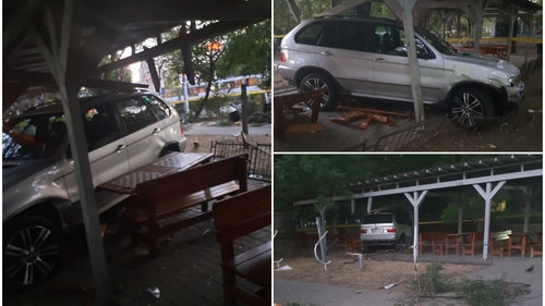 “Performanță” uimitoare a unui șofer cu BMW. A sărit peste un trotuar imens și s-a înfipt în mesele din colțul șahiștilor din Militari