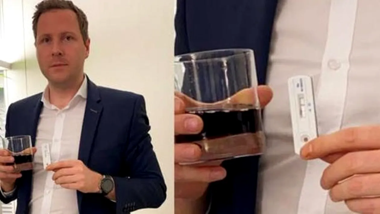 Imagini incredibile în Austria. Un deputat a turnat Coca Cola pe un test rapid covid-19 și a ieșit pozitiv. VIDEO