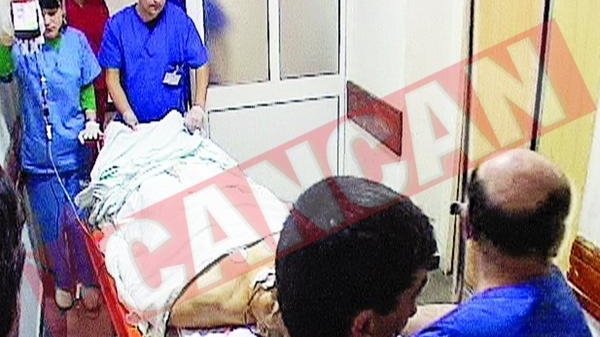 Un politist gelos s-a impuscat in burta