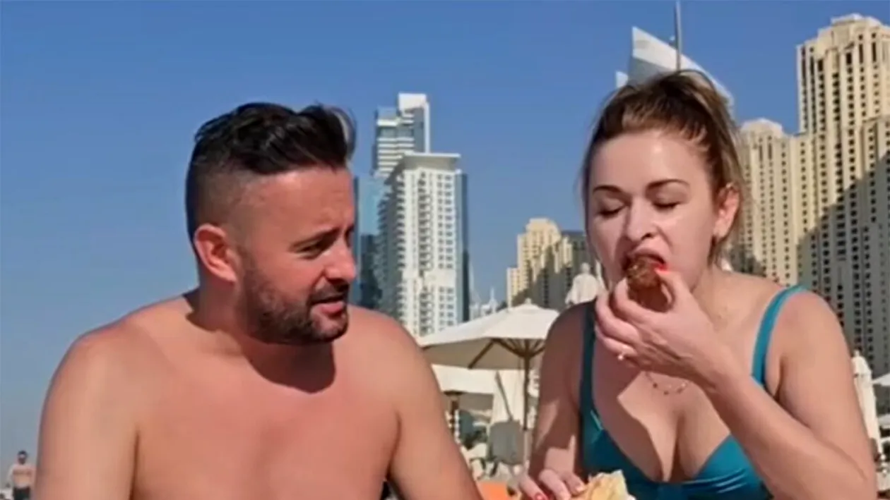 Ce s-a întâmplat după ce acești doi români au mâncat slănină și au băut pălincă, pe o plajă din Dubai