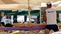 Ce țeapă a luat o turistă care a cerut un masaj profesionist pe plajă în Mamaia! Câți lei a costat și cu ce s-a ales
