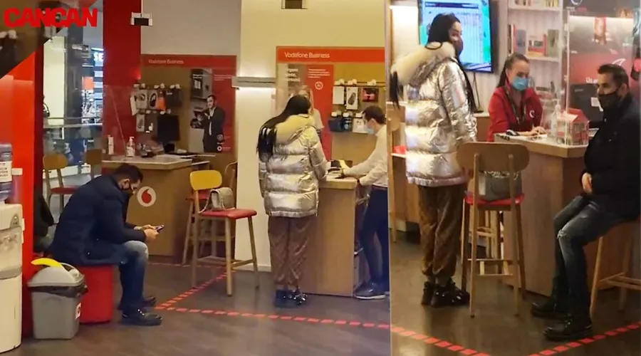 Brigitte s-a “transformat” în propriul ei Moș Crăciun: și-a cumpărat un smartphone lansat de curând pe piață. În timp ce i se făceau actele, soțul ei a stat pe un scaun, fiind preocupat de ceva pe telefonul său © CANCAN.RO