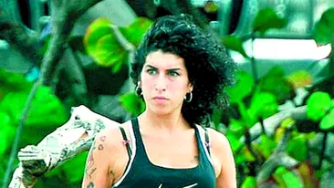 Amy, reptila tatuata, urata de localnici