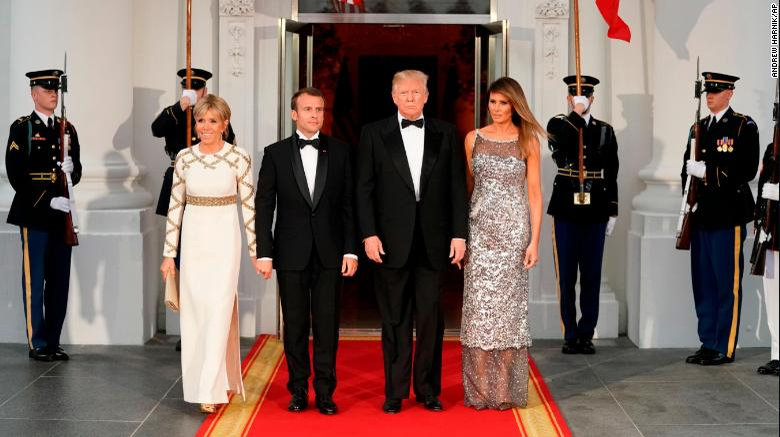 President Donald Trump accompanied by first lady Melania Trump pose for a photo after greeting French President Emmanuel Macron and his wife Brigitte Macron as they arrive for a State Dinner at the White House in Washington, Tuesday, April 24, 2018. (AP Photo/Andrew Harnik)