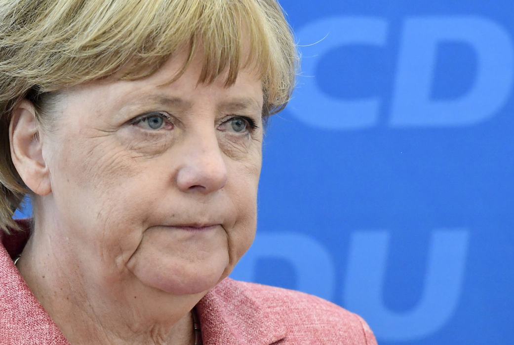 German Chancellor and head of the Christian Democratic Union party CDU Angela Merkel waits for the start of a party board meeting in Berlin on August 15, 2016. / AFP / TOBIAS SCHWARZ        (Photo credit should read TOBIAS SCHWARZ/AFP/Getty Images)