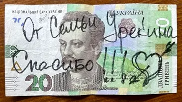 Mesajul incredibil lăsat de o familie de 12 ucraineni pe o bancnotă, după ce au fost găzduiţi de un român: Vă rog, cine poate traduce