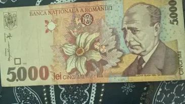 Te-ai putea îmbogăți! Prețul absurd la care se vinde o bancnotă de 5.000 de lei aflată în stare perfectă