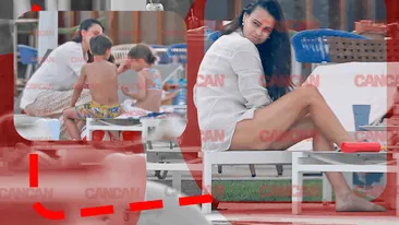 Anca Serea, cu un ochi la copii, cu altul la… Soţia lui Adrian Sînă s-a “ascuns” sub umbreluţă şi a trecut la fapte