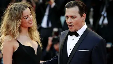 Un nou scandal zguduie Hollywood-ul! După ce a anunţat că divorţează de JOHNNY DEPP după doar 15 luni de căsnicie, AMBER HEARD l-a acuzat de violenţă domestică