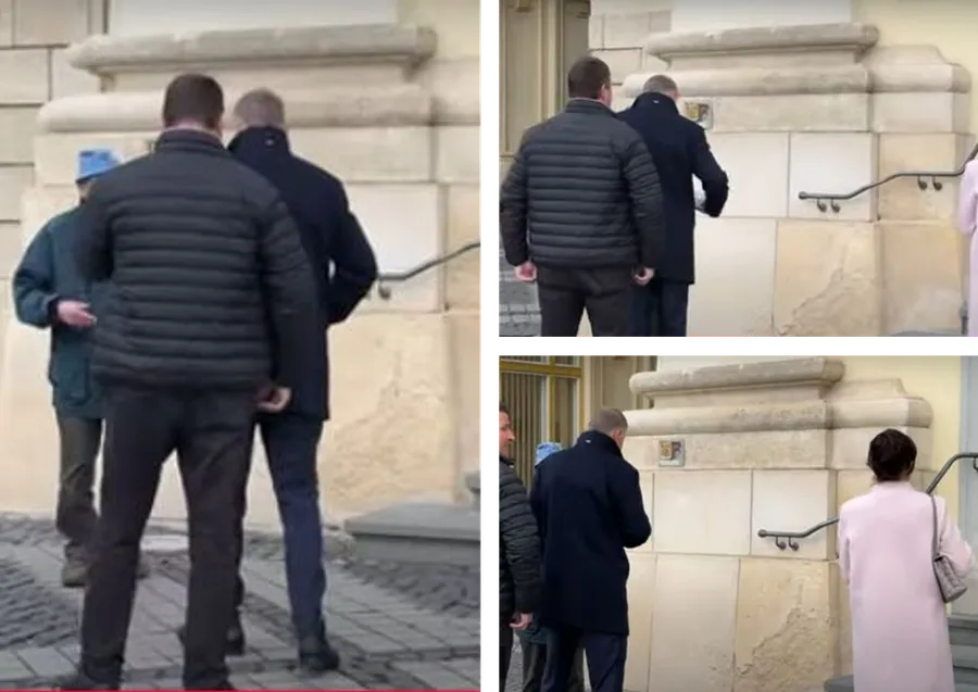 Momentul în care Klaus Iohannis îi oferă bani unui cerșetor. Sursă: Cluj Live TV