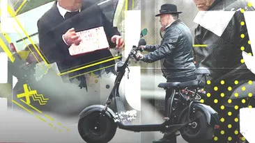 Cerșește la Arcul de Triumf, dar, în realitate, e mare boier…  În ”civilie” se poartă numai la costum și pălărie  + are casă la Buftea și umblă cu scuter de 2.000 €!