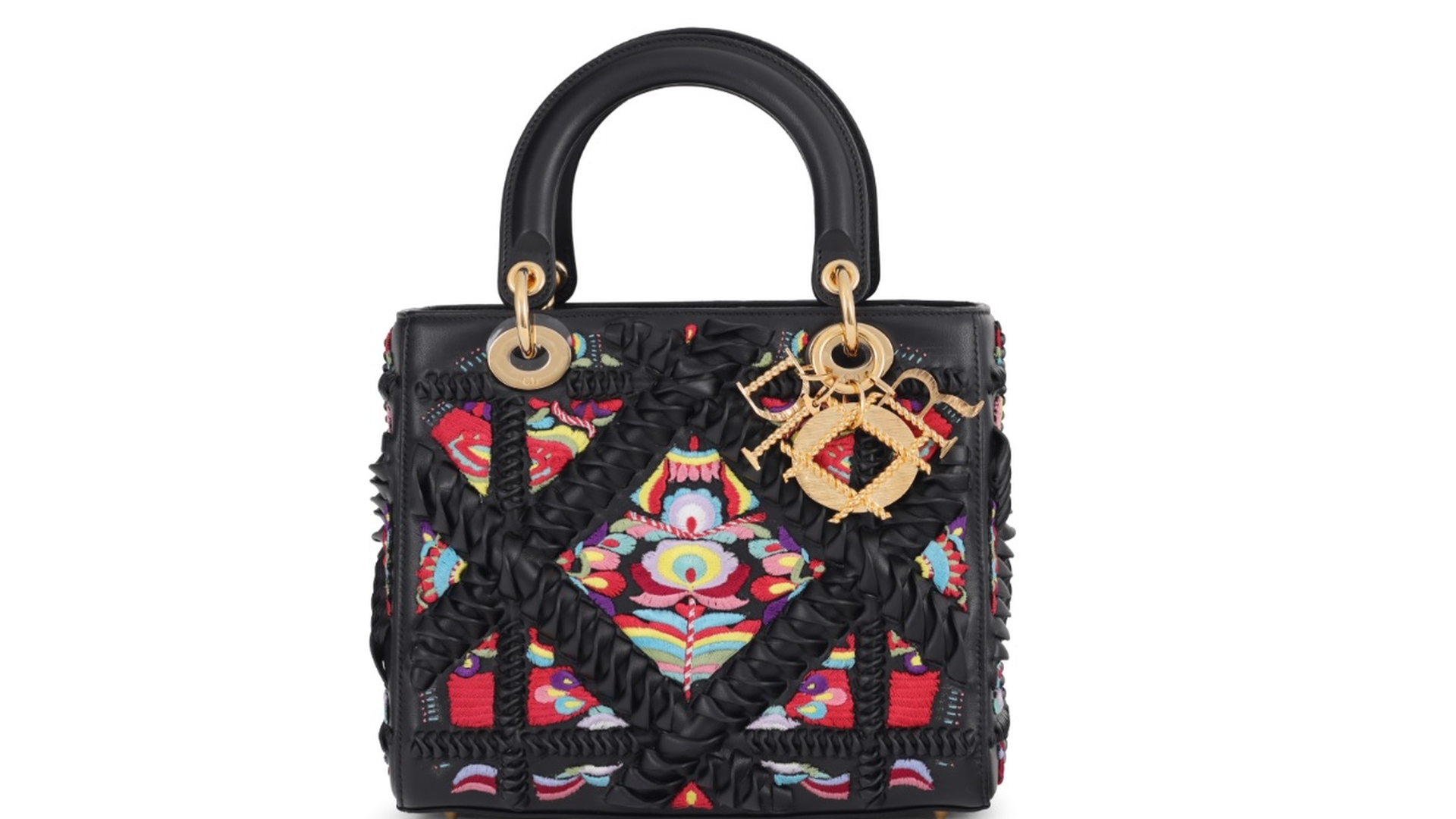 Geanta Lady Dior, reinterpretată de un artist român cu motive din folclorul autohton, va fi scoasă la licitație!
