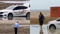 Ei sunt Stan şi Bran din Poliția Română! Unul şi-a suflecat pantalonii ca să poată să scoată maşina împotmolită pe plajă, iar celălalt... VIDEO ireal