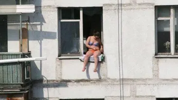 Bronz made in Romania! Gagica asta si-a bagat toti vecinii in alerta cand au vazut-o dezbracata pe geam - Voia sa se bronzeze fara sa iasa din casa