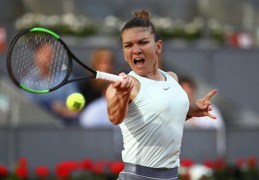 MADRID, SPAIN - MAY 11:  Simona Halep of Romania in action against Kiki Bertens of Netherlands during day eight of the Mutua Madrid Open at La Caja Magica on May 11, 2019 in Madrid, Spain. (Photo by Julian Finney/Getty Images)
