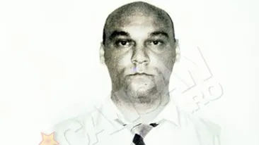 Un politist si-a executat parintii