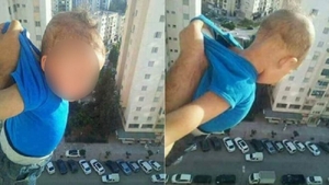 Un tată inconştient şi-a ţinut fiul atârnat pe geam la etajul 15. "O mie de like-uri sau îi dau drumul!" Cum s-a încheiat scena şocantă