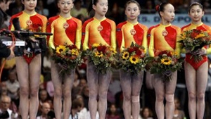 Chinei ii va fi retrasa o medalie,la poba feminina pe echipe, la gimnastica