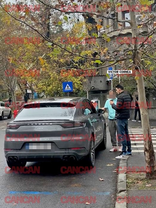 Victor Cornea, lângă mașina logodnicei lui, se încălzește cu o cafea