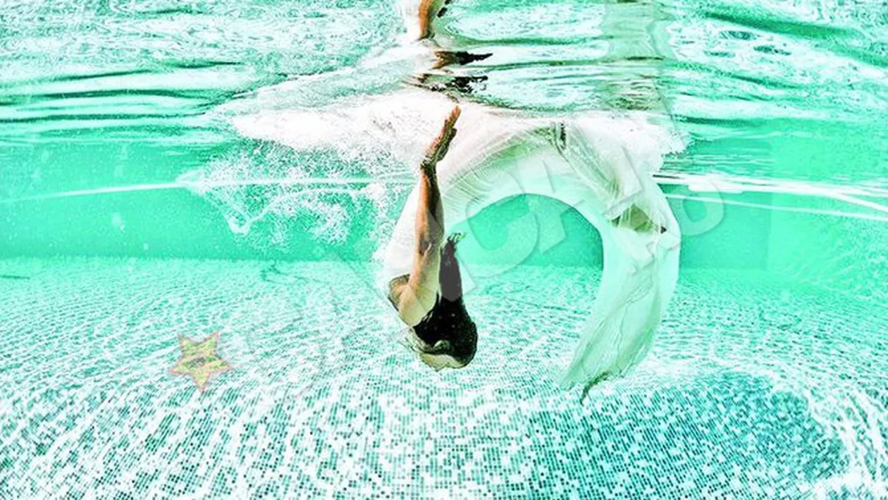 O baschetbalista din Timisoara a vrut sa aiba o amintire speciala de la nunta! S-a aruncat in piscina cu rochia de mireasa